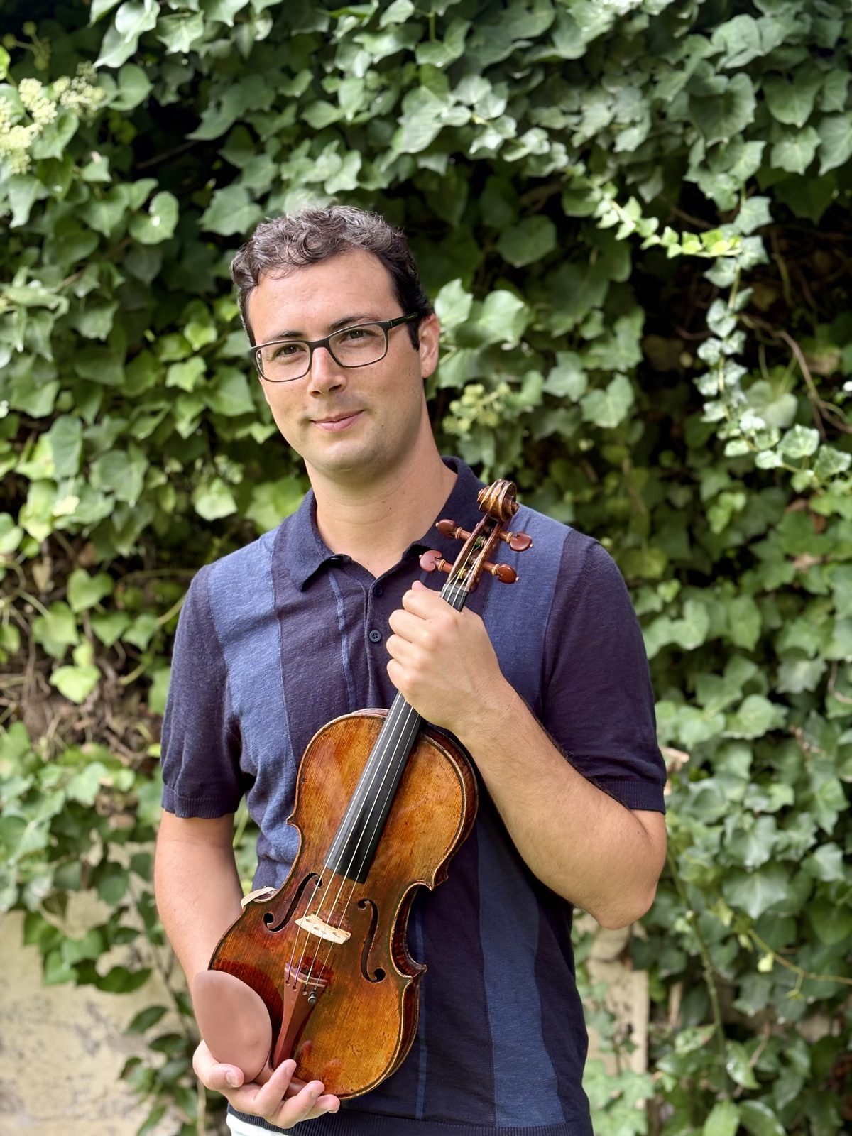 Bartholomew Fortino Shields holding his violin